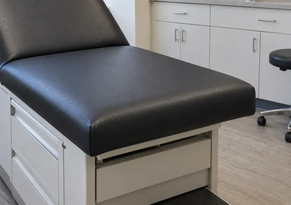 The same black exam table with a new top