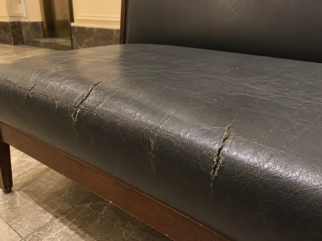 Cracked vinyl on shared building seating