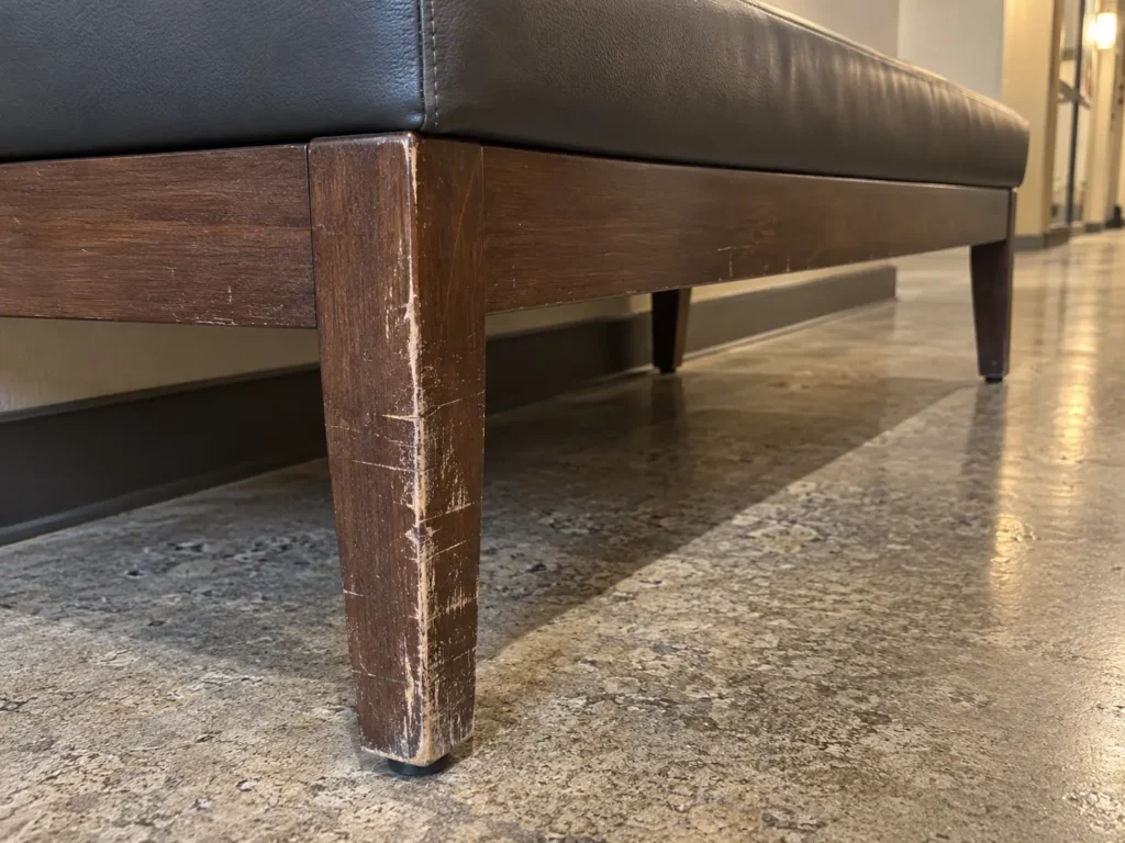 Scraped legs on shared building seating
