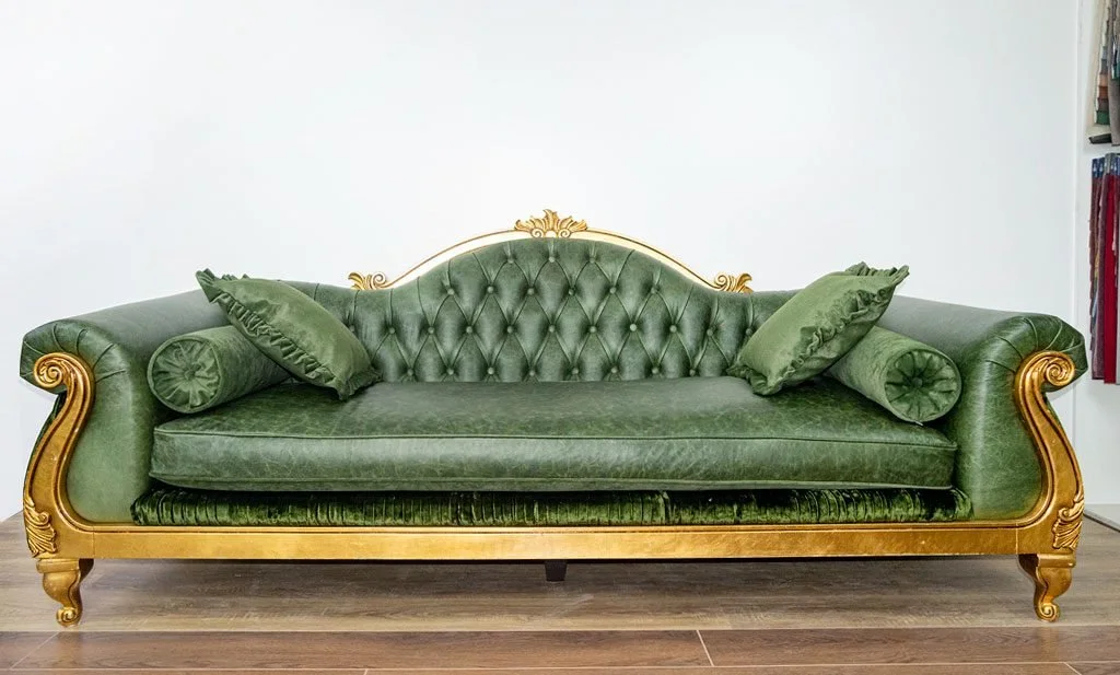 The same gilded sofa recovered in smooth green velvet