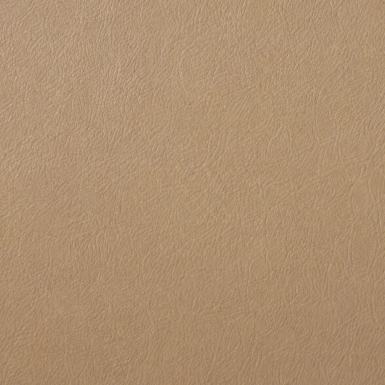 An original factory color swatch next to leather that has aged
