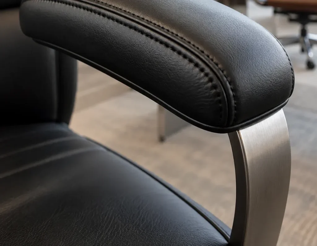Close-up of fresh leather and stitching on an office chair arm