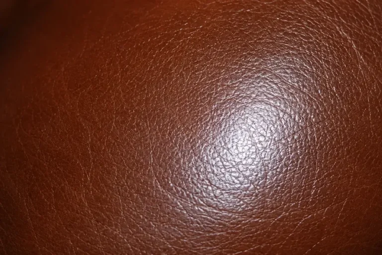 Close-up of leather sheen matched on a repaired scratch