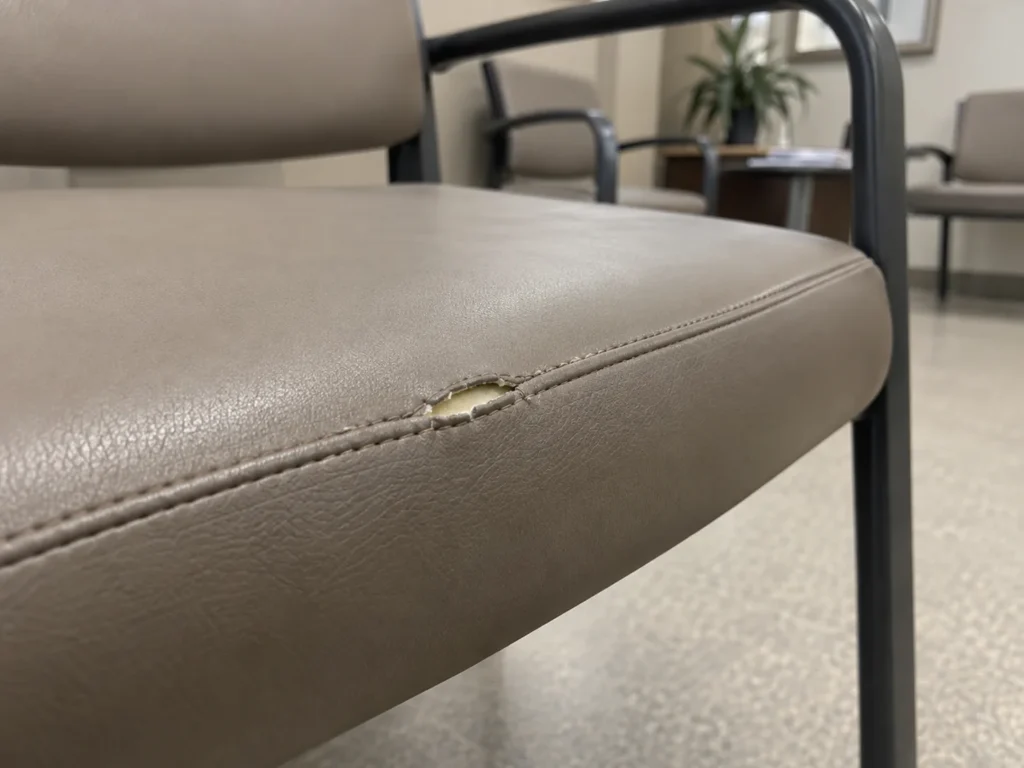 Opened seam on a clinic lobby chair
