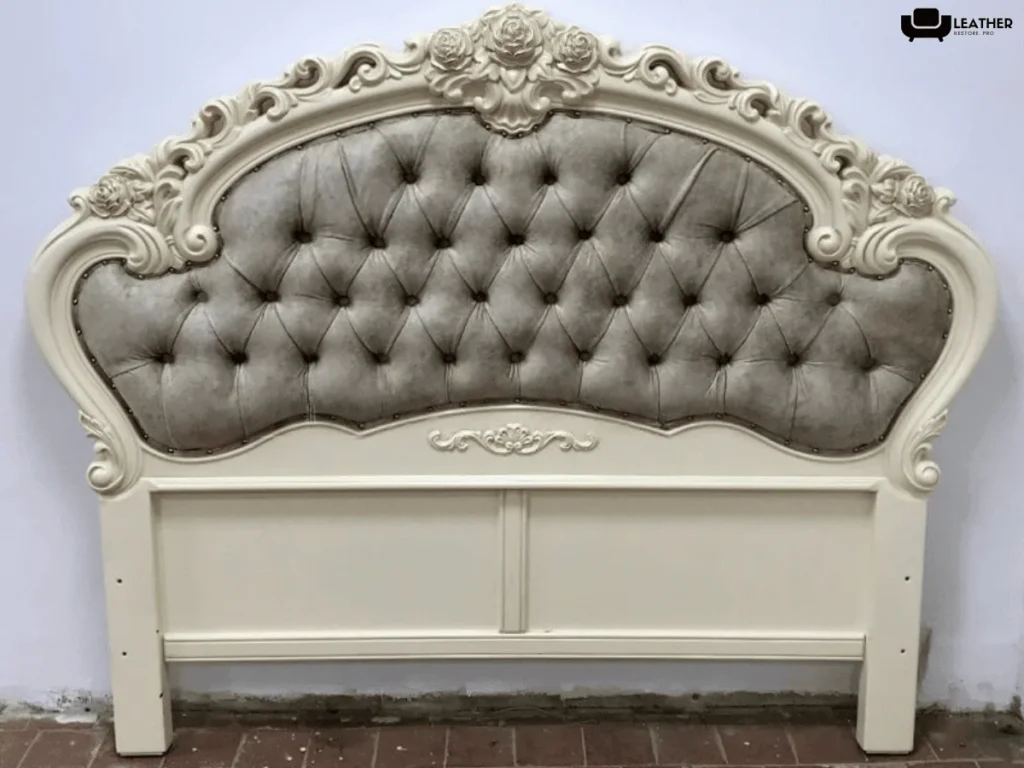The same headboard recovered in gray tufted fabric